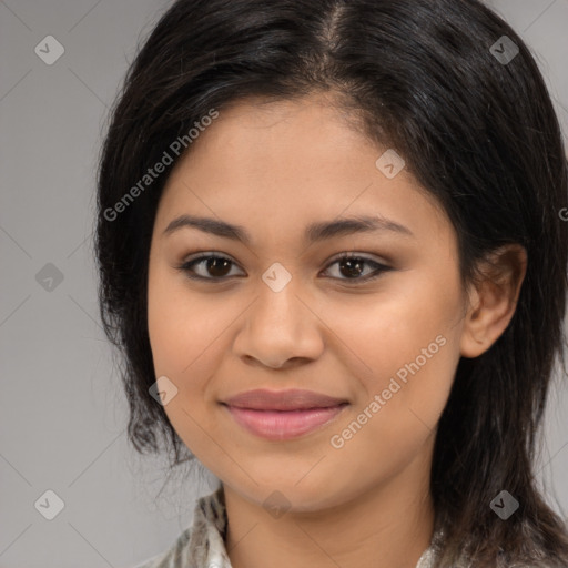 Joyful latino young-adult female with medium  brown hair and brown eyes