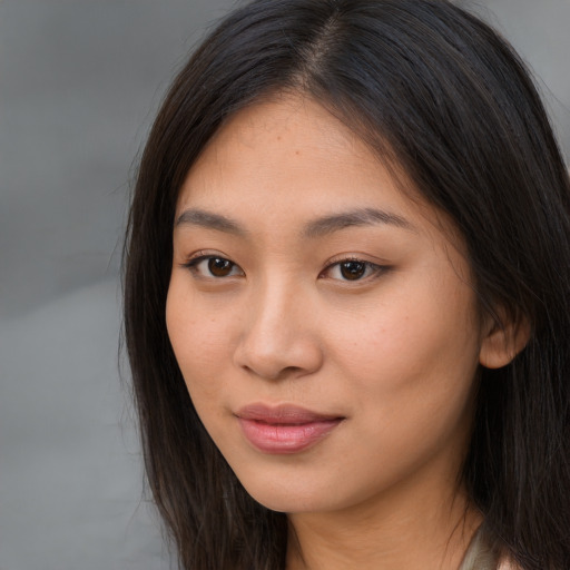 Neutral latino young-adult female with long  brown hair and brown eyes