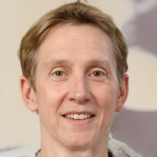 Joyful white adult male with short  brown hair and grey eyes