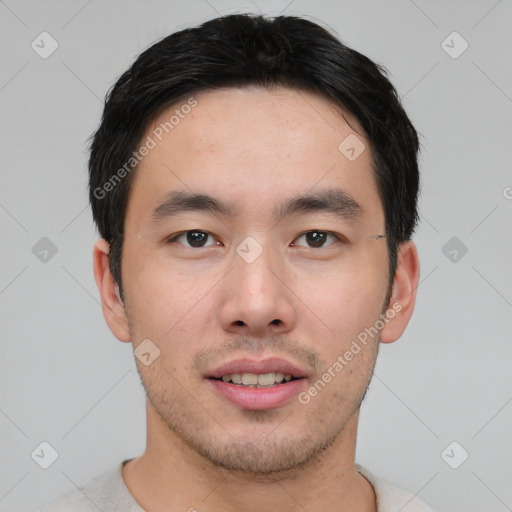 Joyful white young-adult male with short  black hair and brown eyes