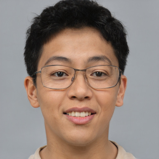Joyful asian adult female with short  brown hair and brown eyes