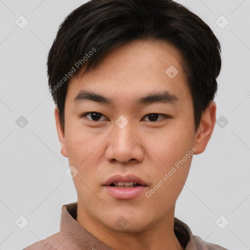 Neutral asian young-adult male with short  black hair and brown eyes