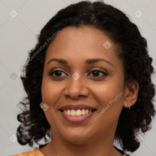 Joyful black young-adult female with medium  brown hair and brown eyes