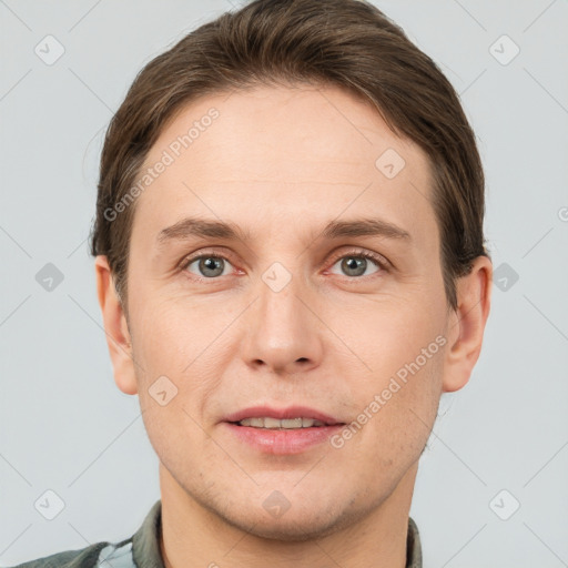 Joyful white adult male with short  brown hair and grey eyes