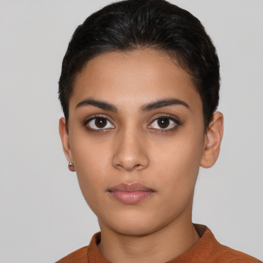 Neutral latino young-adult female with short  brown hair and brown eyes