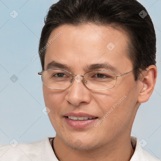 Joyful white adult male with short  brown hair and brown eyes