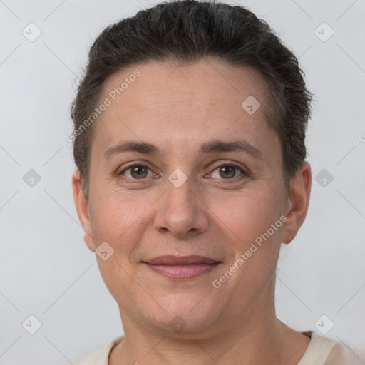 Joyful white adult female with short  brown hair and brown eyes