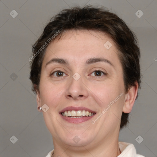 Joyful white adult female with short  brown hair and brown eyes