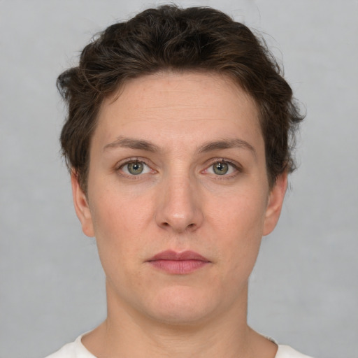 Neutral white young-adult female with short  brown hair and green eyes