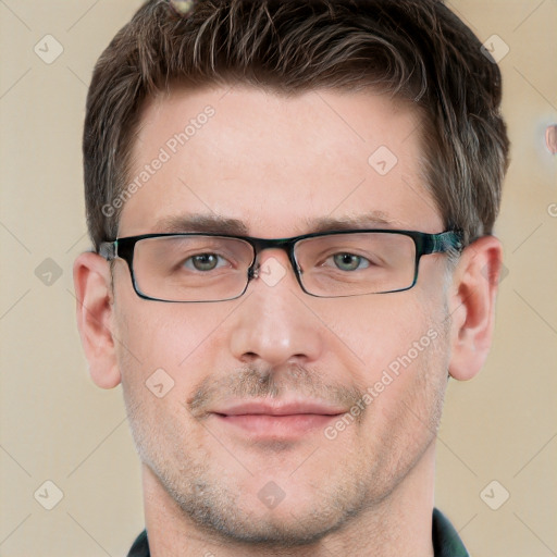 Joyful white adult male with short  brown hair and grey eyes