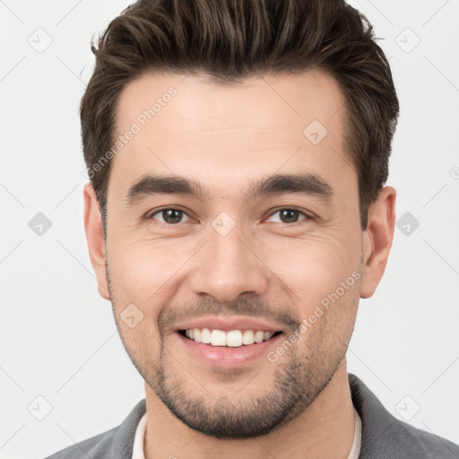 Joyful white young-adult male with short  brown hair and brown eyes