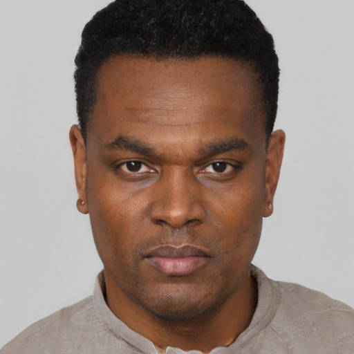 Neutral black young-adult male with short  black hair and brown eyes