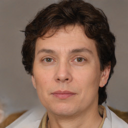 Joyful white adult male with medium  brown hair and brown eyes