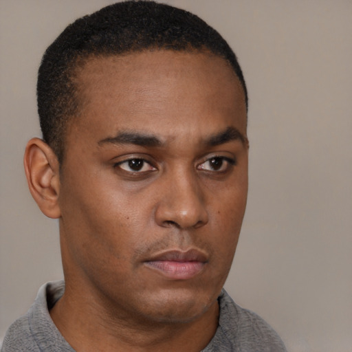 Neutral black young-adult male with short  brown hair and brown eyes