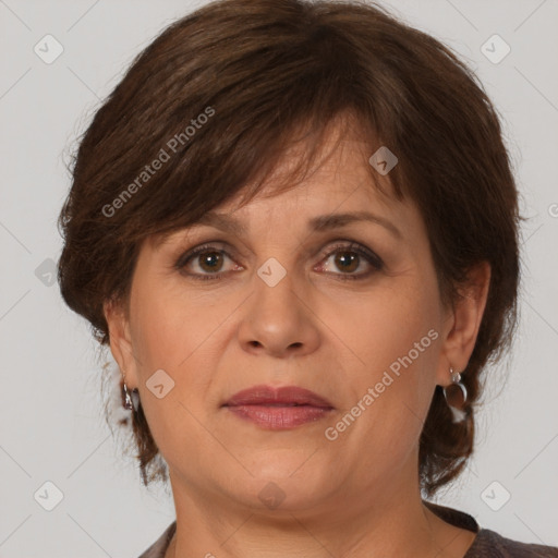 Joyful white adult female with medium  brown hair and brown eyes