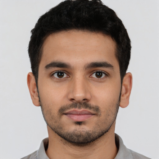 Neutral latino young-adult male with short  black hair and brown eyes
