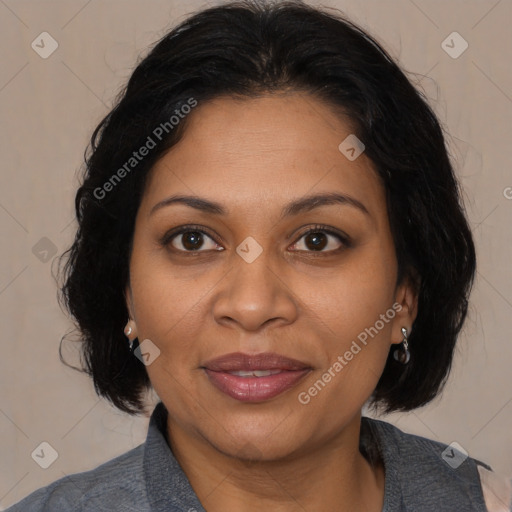 Joyful latino adult female with medium  brown hair and brown eyes