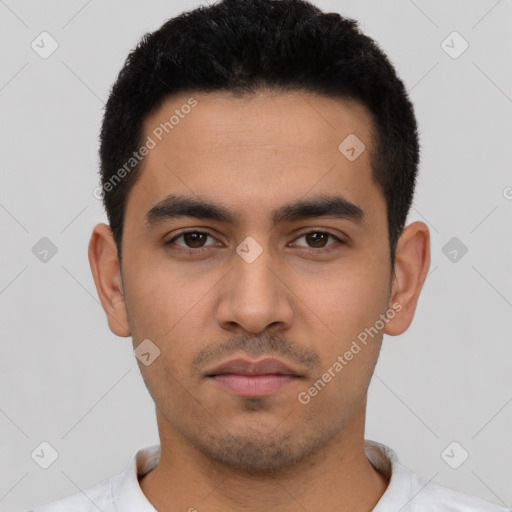 Neutral latino young-adult male with short  black hair and brown eyes