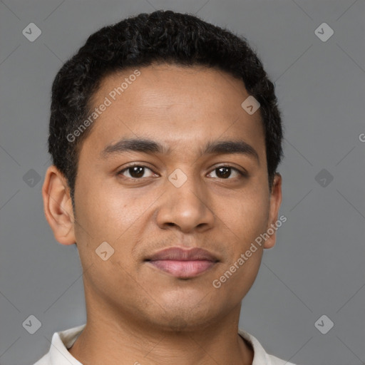 Joyful latino young-adult male with short  brown hair and brown eyes