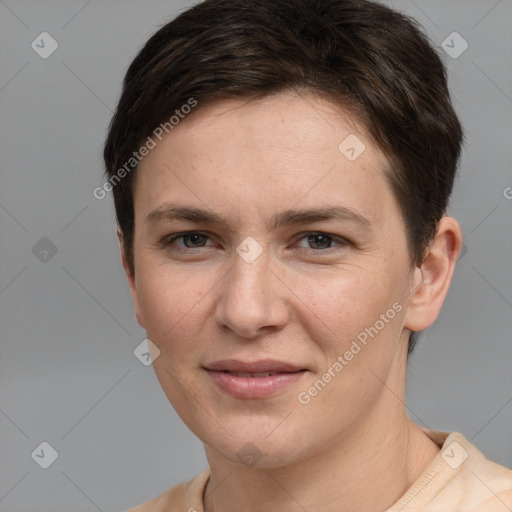 Joyful white young-adult female with short  brown hair and grey eyes