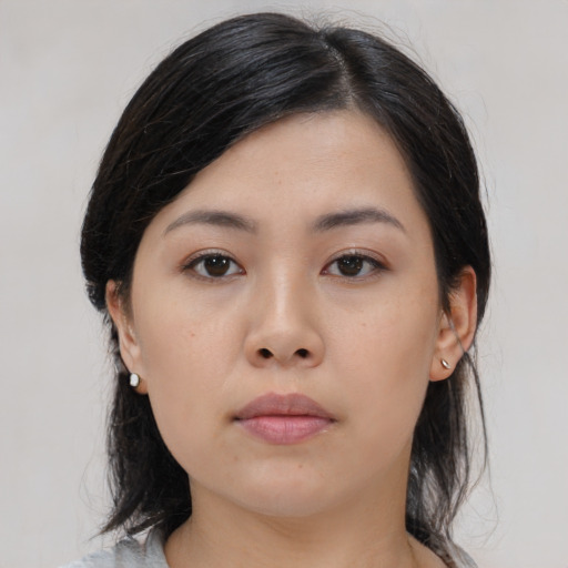 Neutral asian young-adult female with medium  black hair and brown eyes