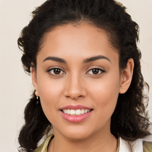 Joyful white young-adult female with long  brown hair and brown eyes