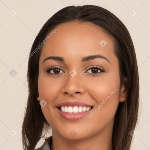 Joyful white young-adult female with long  brown hair and brown eyes