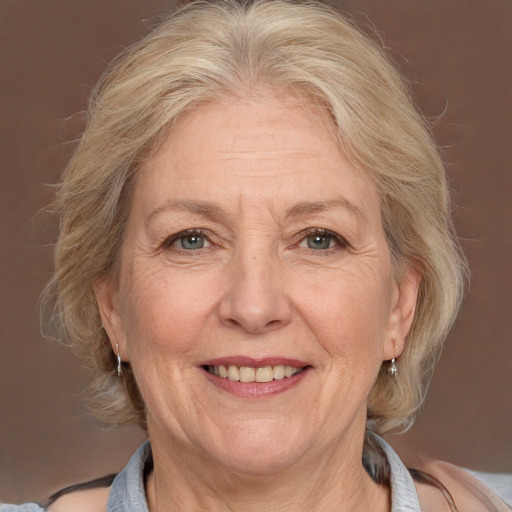 Joyful white middle-aged female with medium  blond hair and brown eyes