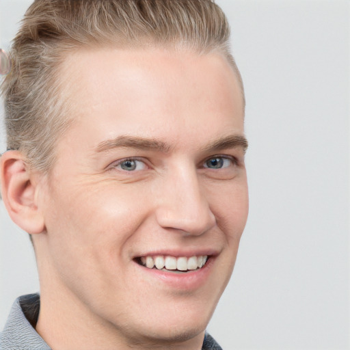 Joyful white adult male with short  brown hair and grey eyes