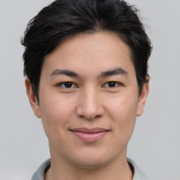 Joyful asian young-adult male with short  brown hair and brown eyes