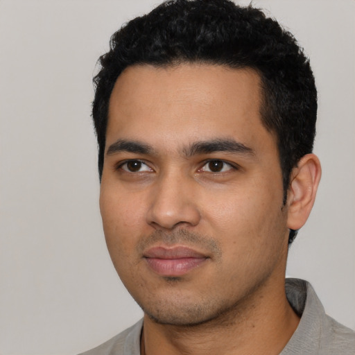 Neutral latino young-adult male with short  black hair and brown eyes