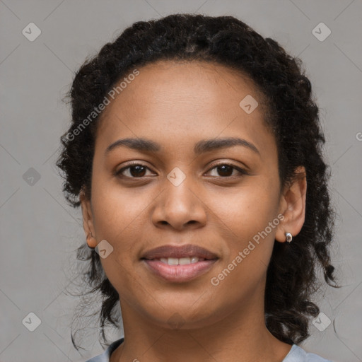 Joyful black young-adult female with long  brown hair and brown eyes