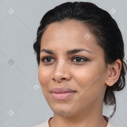 Joyful black young-adult female with medium  brown hair and brown eyes