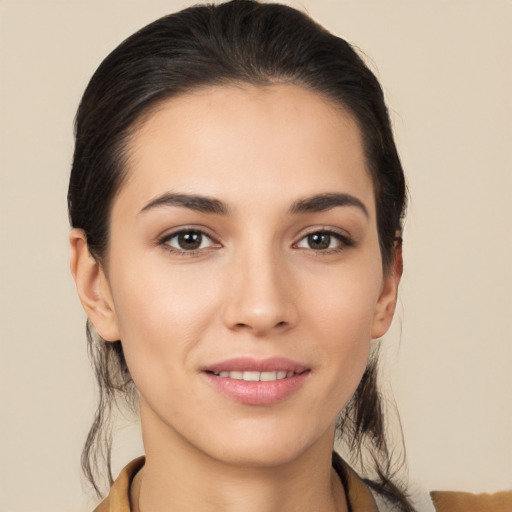 Joyful white young-adult female with medium  brown hair and brown eyes