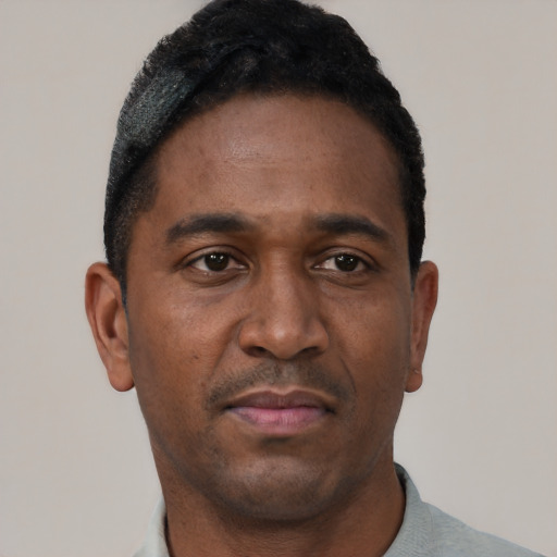 Neutral black young-adult male with short  black hair and brown eyes