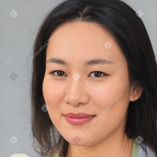 Joyful asian young-adult female with medium  brown hair and brown eyes