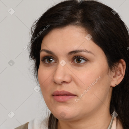 Joyful white adult female with medium  brown hair and brown eyes