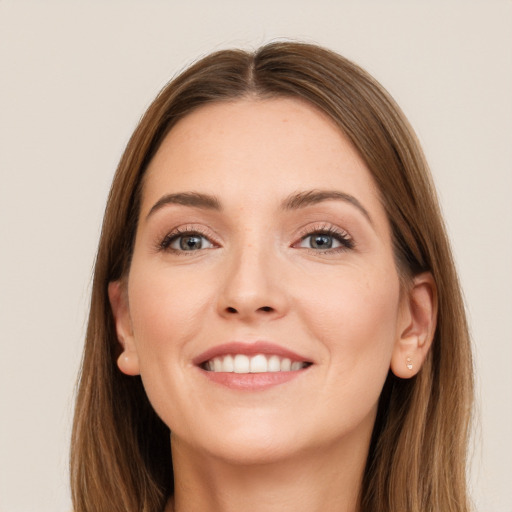 Joyful white young-adult female with long  brown hair and grey eyes