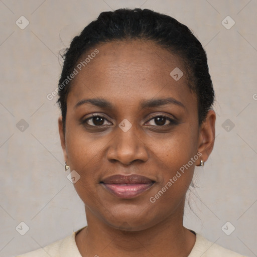 Joyful black young-adult female with short  black hair and brown eyes