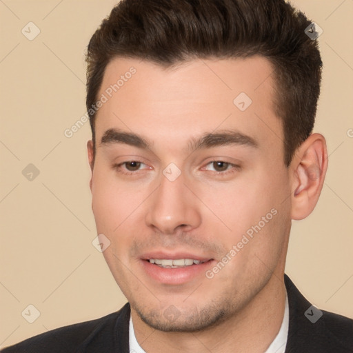 Joyful white young-adult male with short  brown hair and brown eyes