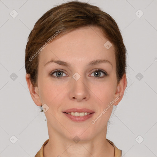 Joyful white young-adult female with short  brown hair and grey eyes