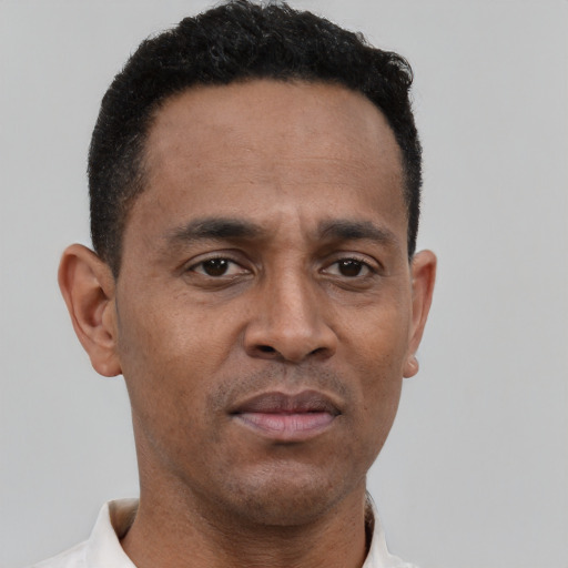Neutral latino young-adult male with short  brown hair and brown eyes
