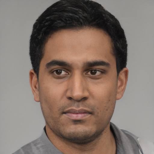 Neutral latino young-adult male with short  black hair and brown eyes