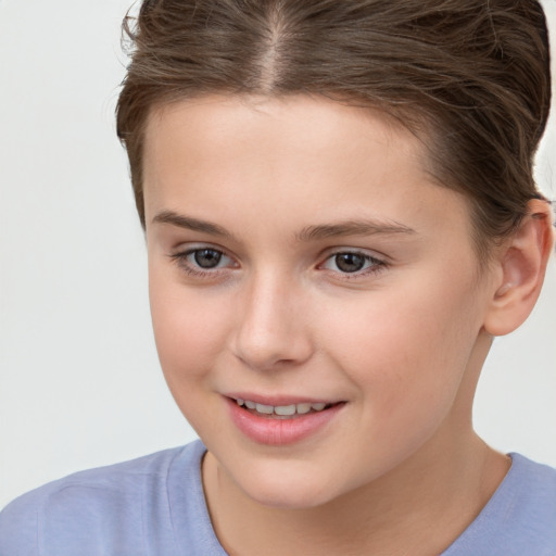 Joyful white child female with short  brown hair and brown eyes