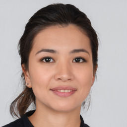 Joyful asian young-adult female with medium  brown hair and brown eyes