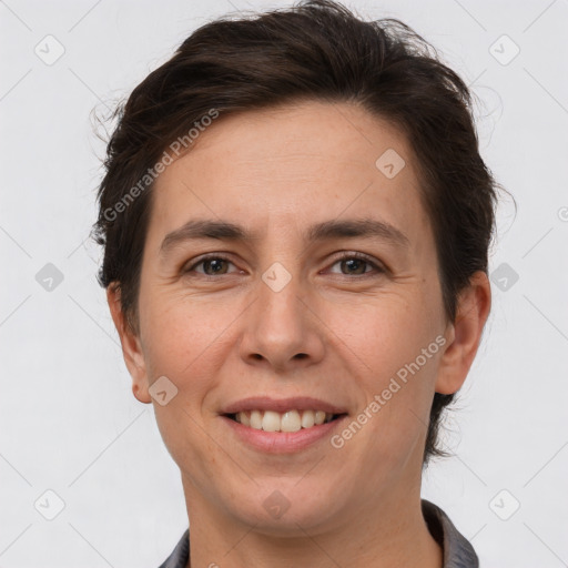 Joyful white adult female with short  brown hair and brown eyes