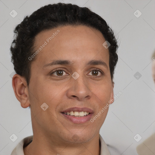 Joyful latino young-adult male with short  brown hair and brown eyes