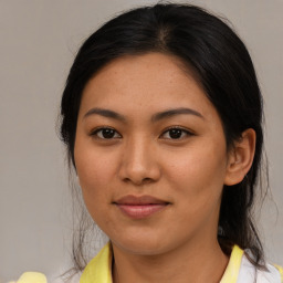 Joyful asian young-adult female with medium  brown hair and brown eyes