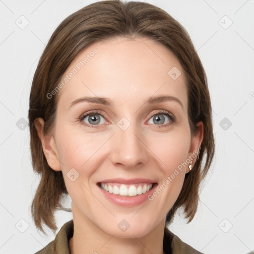 Joyful white young-adult female with medium  brown hair and grey eyes