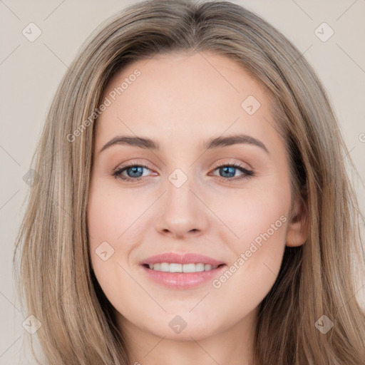 Joyful white young-adult female with long  brown hair and grey eyes